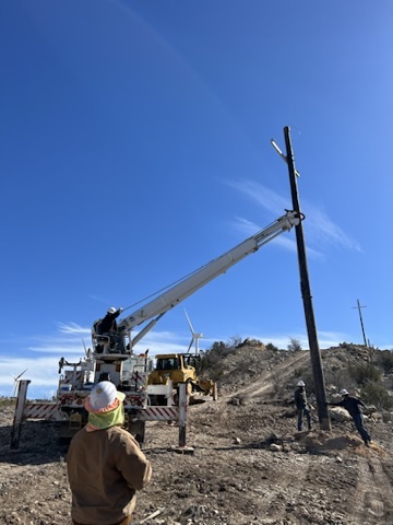 KTX line crew installing a utility pole in West Texas