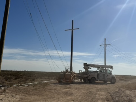 KTX crews and equipment setting utility poles
